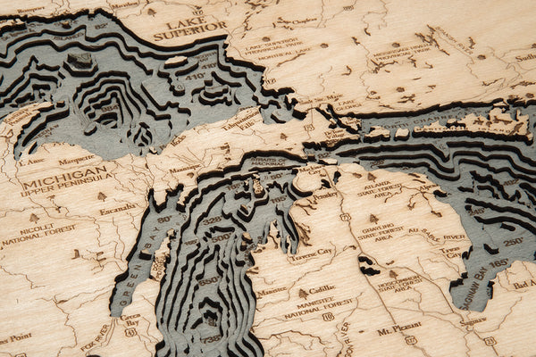 Great Lakes wood chart map made using a darker green and natural colored wood up close