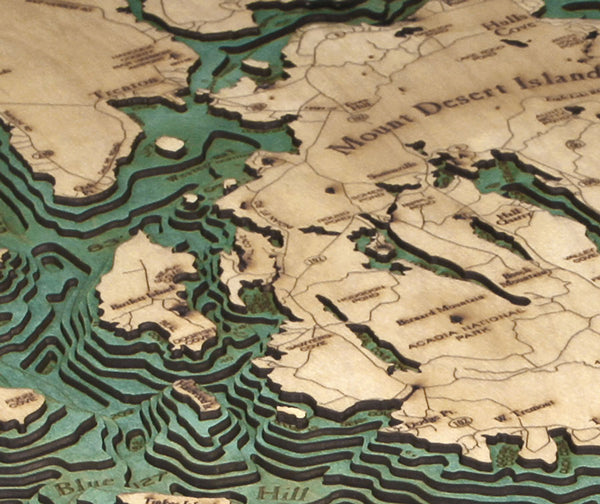 bar harbor / mount desert island in Maine wood chart on black background up close