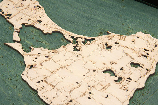 Wooden Block Island serving tray using green and natural colored wood up close