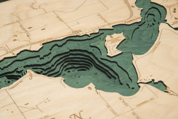 Crooked Lake, Michigan wood chart map made using green and natural colored wood up close