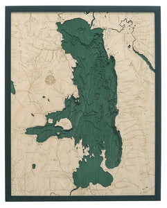 Flathead Lake, Montana wood chart map made using green and natural colored wood on white background with dark frame