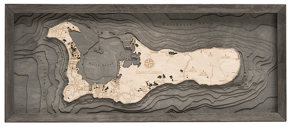 Grand Cayman wood chart map made using a darker green and natural colored wood on white background with dark frame