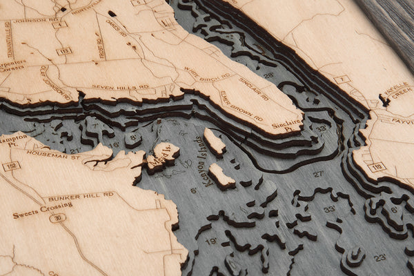 Great Sacandaga Lake wood chart map made using a darker green and natural colored wood up close