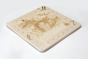 Great Lakes cribbage board laying flat with pegs on it on white background