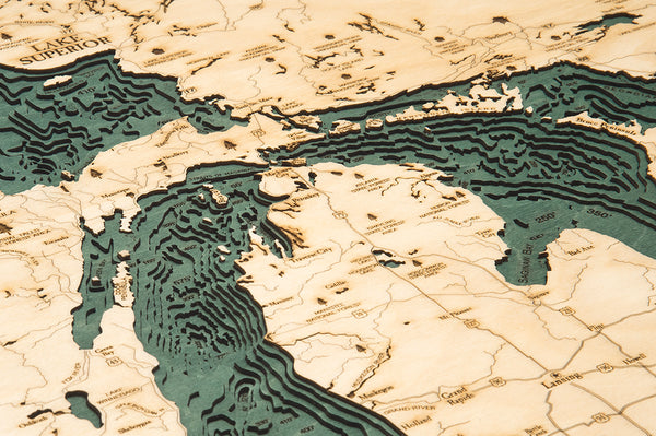 Great Lakes wood chart map made using green and natural colored wood up close