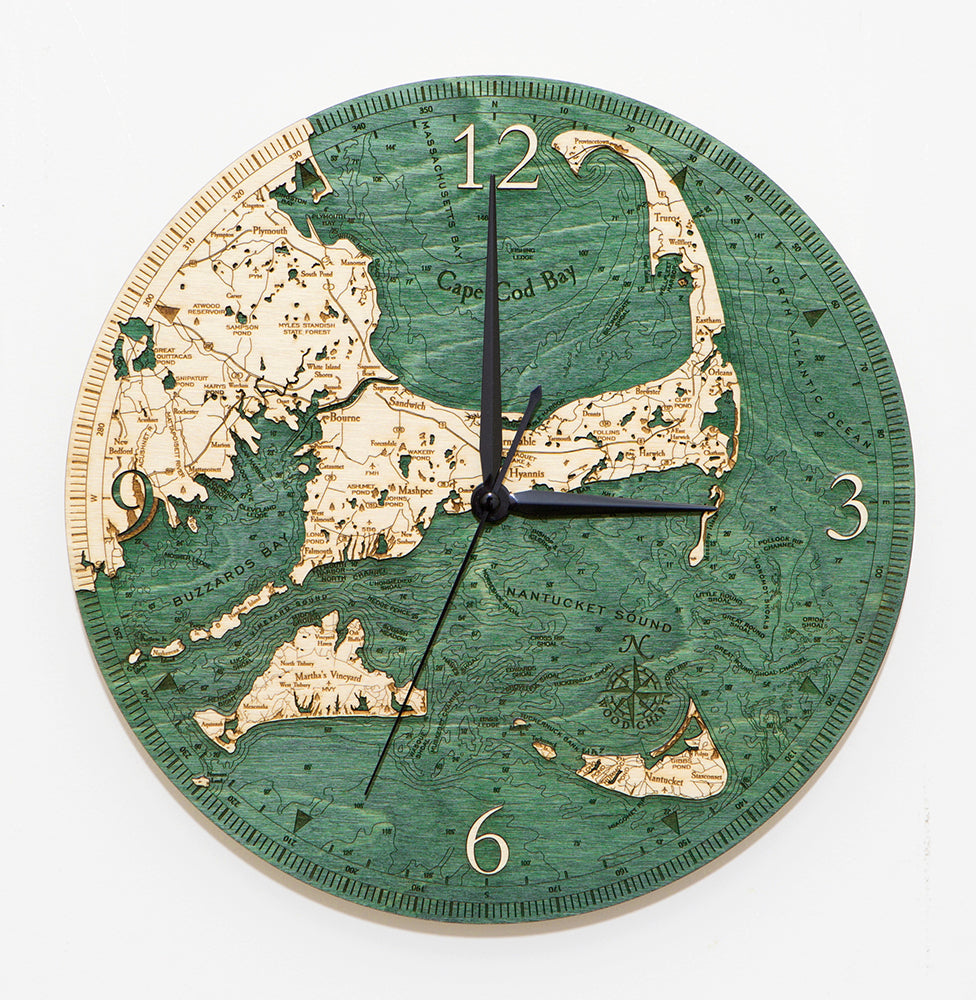 Cape Cod clock made using green and natural wood on white background