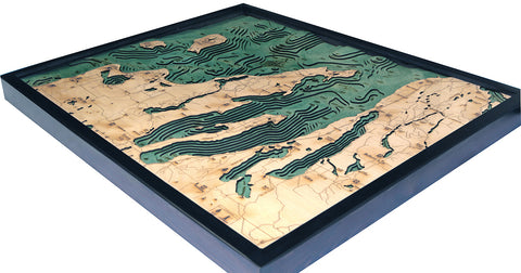Grand Traverse Bay wood chart map made using green and natural colored wood on white background with dark frame laying flat