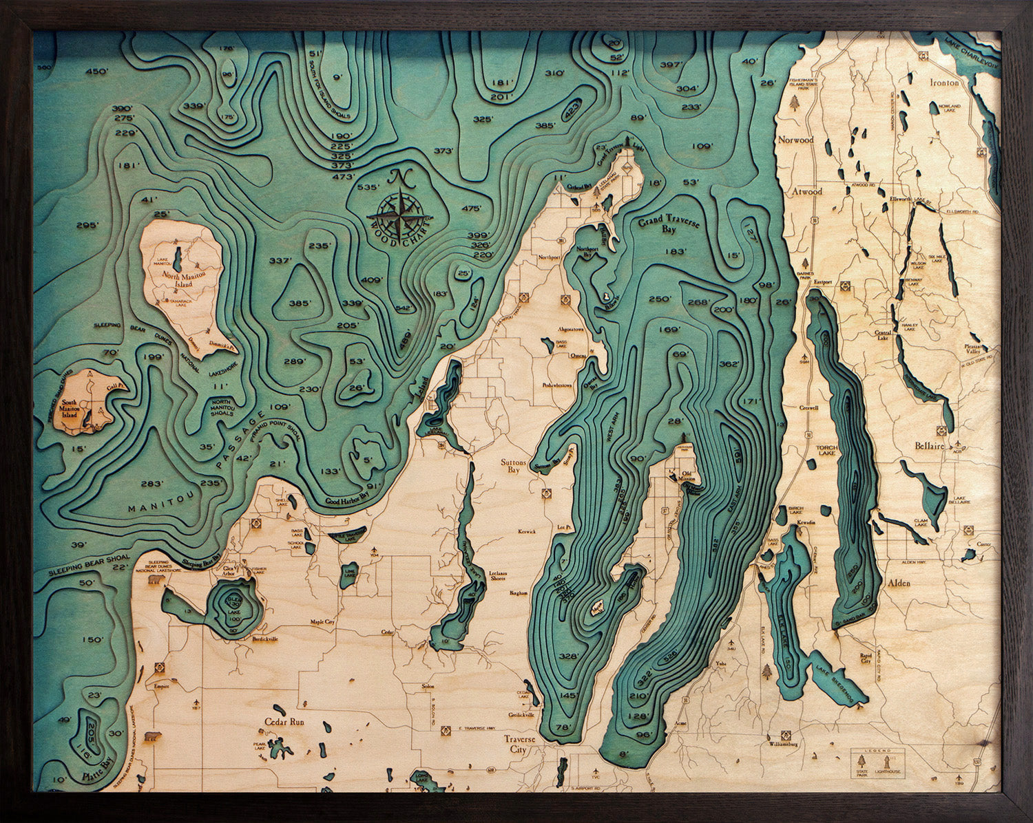 Grand Traverse Bay wood chart map made using green and natural colored wood on black background with dark frame